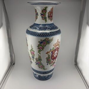 Ornate Porcelain Vase with Floral and Crest Motif